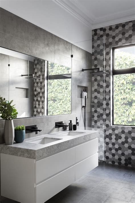 Matte Black Accents Add Sophistication To This Grey And White Bathroom