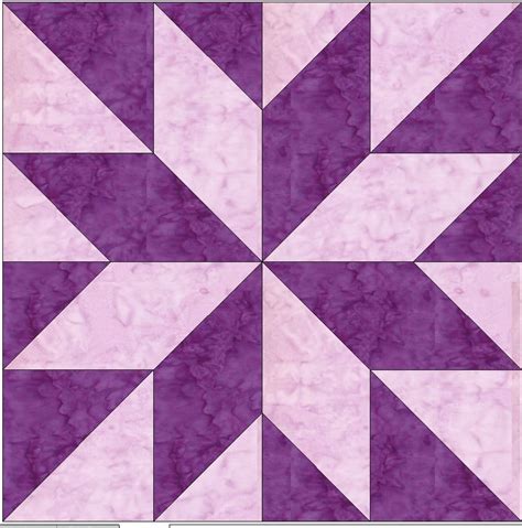 a purple and white quilt block with an arrow design on it's center piece