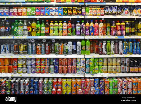 Soft drink cans and bottles including some sugary and fizzy drinks on ...