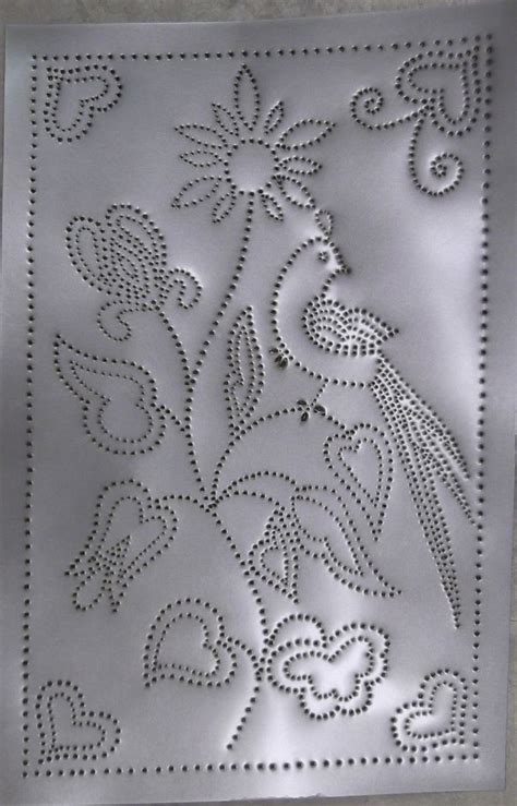 a metal plate with an embroidered design on it