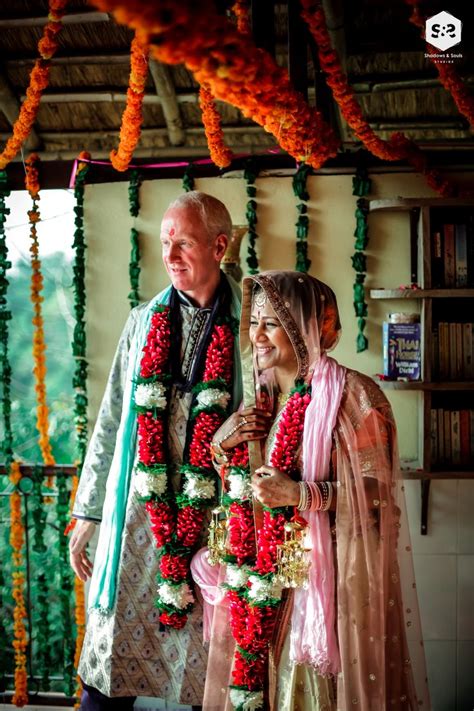 a man and woman standing next to each other