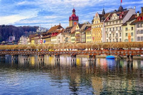 Lucerne, Switzerland, view over Reuss river to the old town and wooden Chapel bridge ...