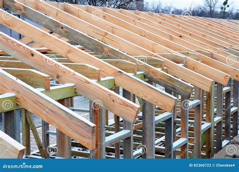 Installation of Wooden Beams at Construction the Roof Truss System of the House. Stock Photo ...