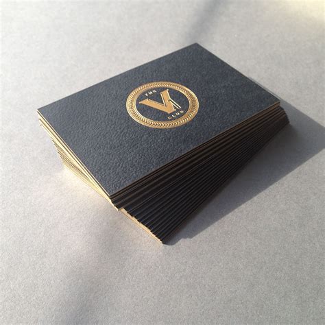 Stunning textured 600gsm business cards duplexed with debossed gold crest & white foil using ...