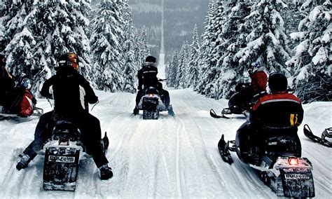 Spectacular photos of snowmobilers riding snowy border between Sweden and Norway | Daily Mail Online