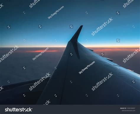 Airplane Window Seat View During Sunset Stock Photo 1330745657 ...