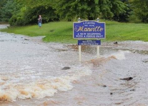 Photo Gallery • Flood at the Welcome to Manville Sign