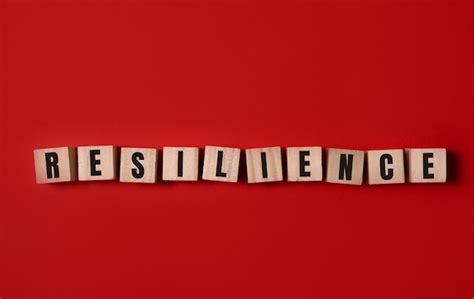 Premium Photo | Resilience symbol. wooden cubes with word 'resilience'. beautiful red background ...