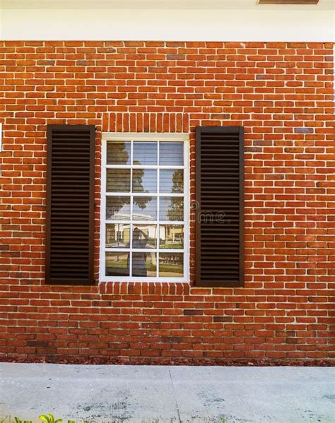 Brick Wall with a Window and Black Shutters Stock Photo - Image of masonry, textured: 166148216