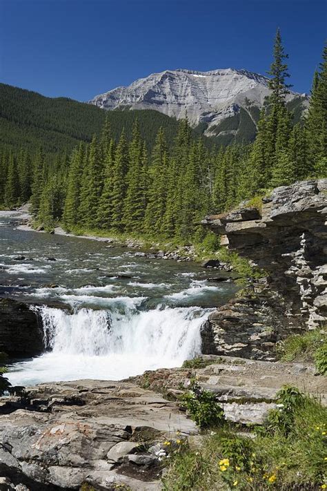 Waterfalls With Rock Ledge And Mountain Photograph by Michael ...