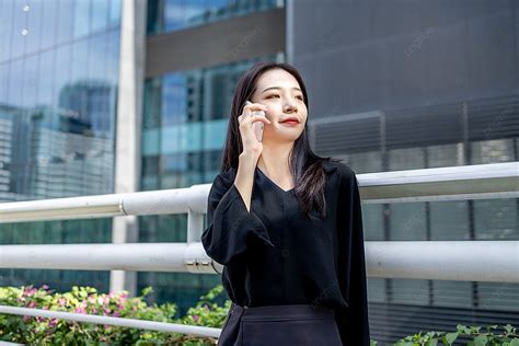 Business Office Afternoon Business Woman Making A Phone Call On Pedestrian Bridge Background ...