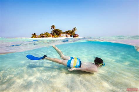 - Split image of boy snorkeling underwater, Maldives | Royalty Free Image