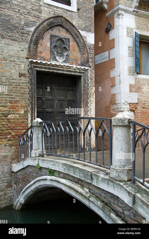 Decorative Venetian door and bridge Stock Photo - Alamy