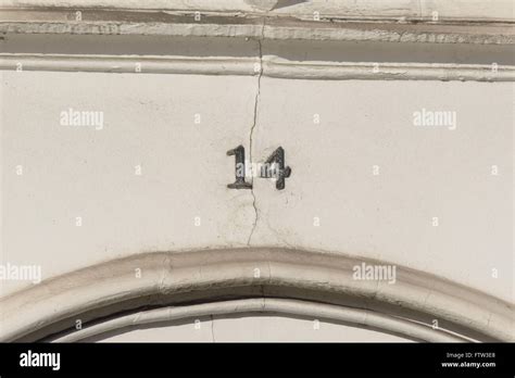 House number 14 sign above doorway Stock Photo - Alamy