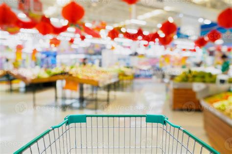 shopping cart with supermarket blur background 11671599 Stock Photo at Vecteezy