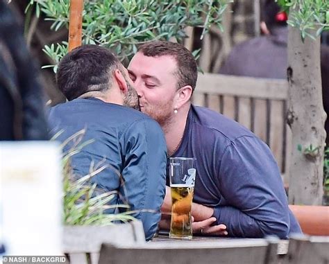 Sam Smith looks smitten as they passionately kiss hunky new boyfriend Francois Rocci - ReadSector