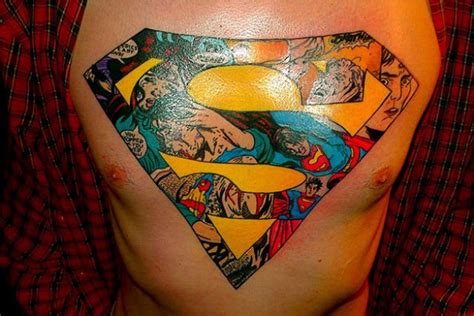 Colorful Superman Logo Geek Tattoo On Man Chest