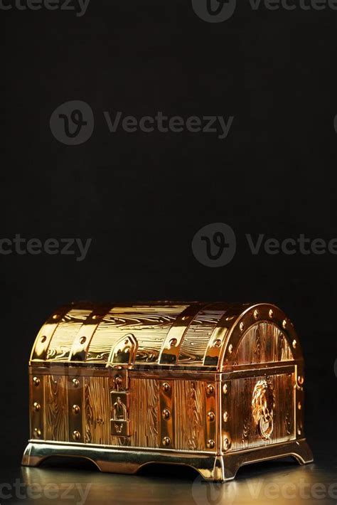 Gold treasure chest on a black textured background. 13150483 Stock ...