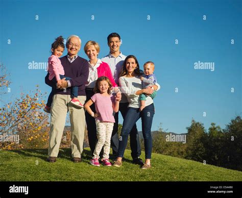 Family smiling together outdoors Stock Photo - Alamy