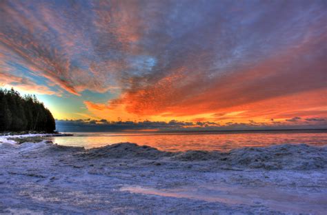 Icy lakeshore at dawn at Whitefish Dunes State Park, Wisconsin image ...