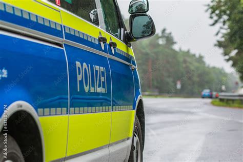 Passenger side of a German police car. View of the lettering Police on ...