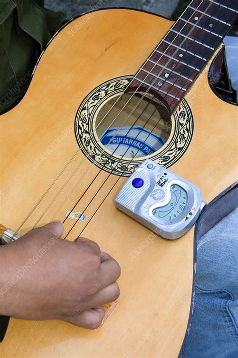 Electric Tuner on Acoustic Guitar - Stock Image - C001/8019 - Science ...