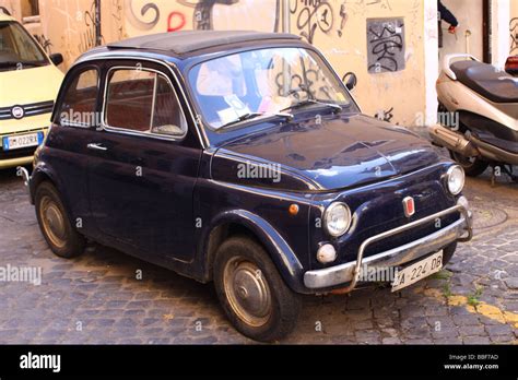 Old blue Fiat 500 parked Stock Photo - Alamy