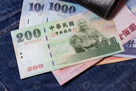 Taiwanese money, Taiwan Banknote, Taiwan dollar on jean background. 6981466 Stock Photo at Vecteezy