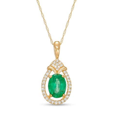 Oval Emerald and 1/6 CT. T.W. Diamond Open Frame Teardrop Pendant in ...