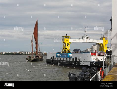 Woolwich Ferry docking at Woolwich Terminal on the River Thames, UK ...