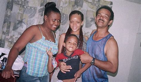 A young Rihanna with her mother, father, and brother. -- Barbados, ca ...