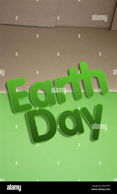 Earth Day word with cardboard box. Brown folded card box Stock Photo - Alamy