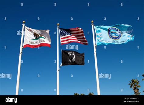 Flags flying at Huntington Beach pier Orange County California USA ...