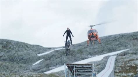 Watch Tom Cruise Drive a Motorcycle Off a Mountain in Ridiculous ...