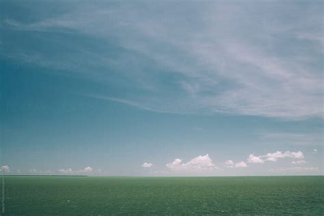 "Sea Horizon With Cloudy Sky" by Stocksy Contributor "Gabriel Tichy ...