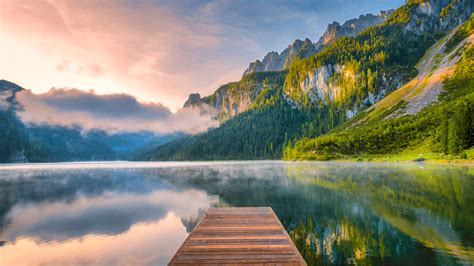 Sunrise with fog over alpine lake Vorderer Gosausee, Gosau valley in ...