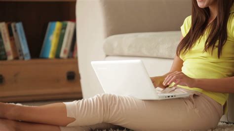 Beautiful Girl Sitting On Floor With Laptop Stock Footage SBV-303990078 - Storyblocks