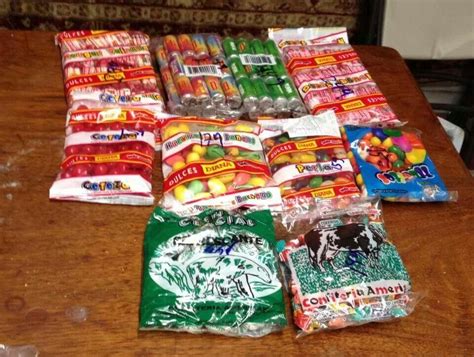 many bags of candy are sitting on the table