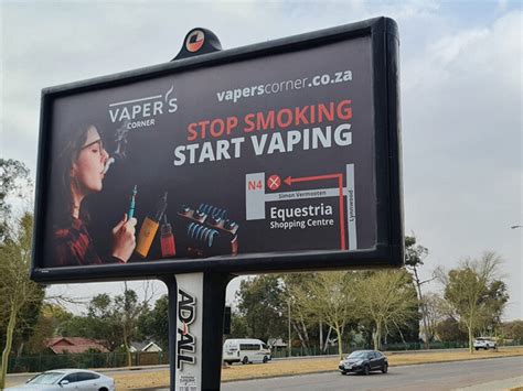 Billboard advert of e-cigarette store promoting e-cigarette use ...