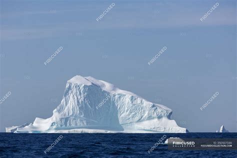 Majestic iceberg formation on sunny blue Atlantic Ocean Greenland — awe inspiring, nature ...