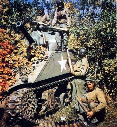 The crew of an M4 Sherman tank loads up on ammo. Pine Camp, New York, fall 1943. : r/TankPorn