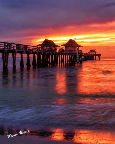 Sunset Over The Naples Pier Photograph by Karen Regan