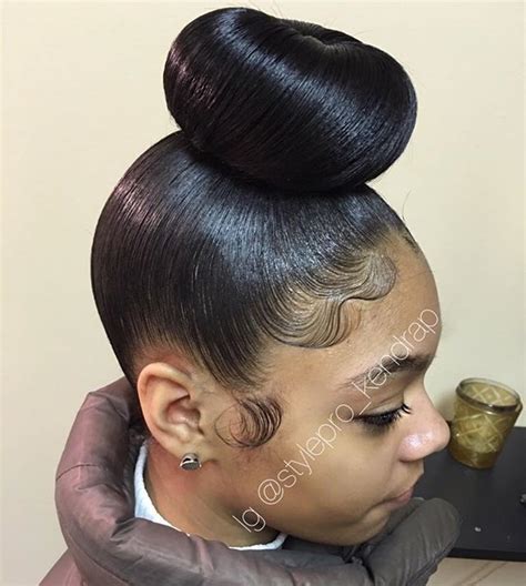 Gorgeous Bun by @stylepro_kendrap on IG | Natural hair styles, Hair styles, Long hair styles