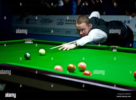 Scottish professional snooker player Stephen Hendry plays a shot during ...