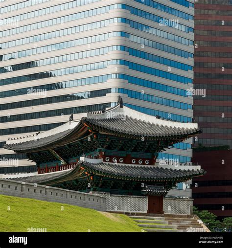 A modern office building and building of traditional Korean architecture; Seoul, South Korea ...