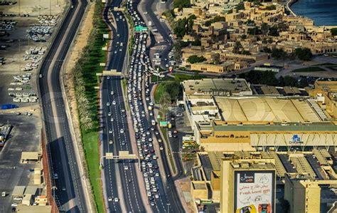 DUBAI - NOVEMBER 2016: Aerial view of main road and city traffic. Dubai attracts 20 million ...