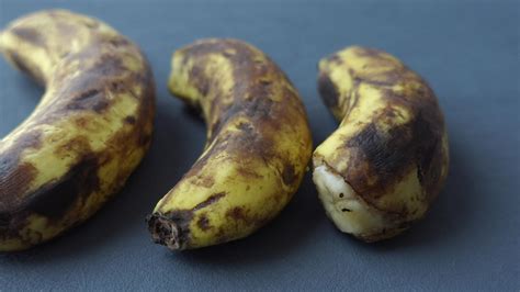 comparing rotten banana with a ripe banana on a white background 32035908 Stock Video at Vecteezy