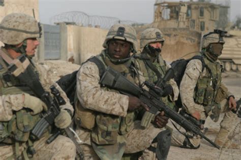 U.S. Marines prepare to step off on a patrol through the city of Fallujah, Iraq.