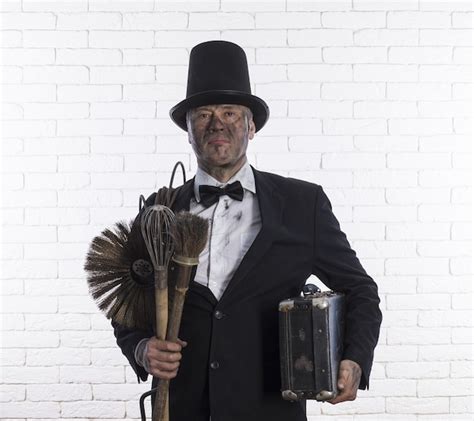 Premium Photo | Portrait of a chimney sweep in soot a brush for ...