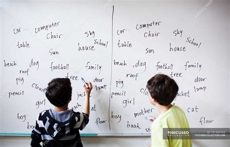 Boys writing on whiteboard — School Building, horisont - Stock Photo ...